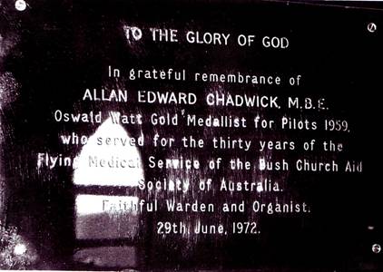 A memorial plaque denoting his achievements below.